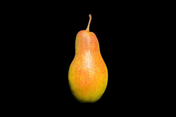 A ripe pear isolated on on a black background