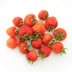 Top view of ripe strawberries, red berries on white background.