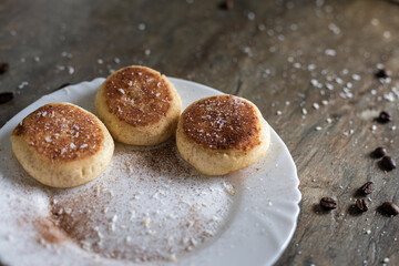 Fresh cheesecake with a cup of coffee on the table in the kitchen