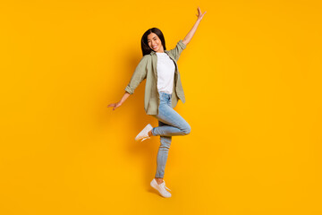 Full size photo of overjoyed satisfied lady toothy smile enjoy free time isolated on yellow color background
