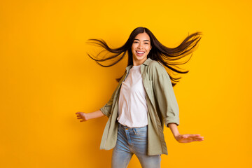Photo of cheerful overjoyed person beaming smile have good mood clubbing isolated on yellow color background