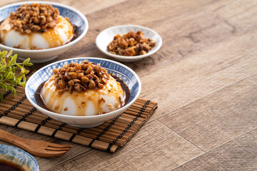 Taiwanese savory rice pudding Wa gui with chopped dried radish and soy sauce