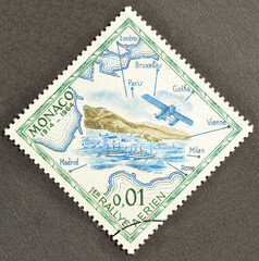 Cancelled postage stamp printed by Monaco, that shows Monte Carlos, seaplane, rally map of 1914, First flight rally to Monaco, 50th anniversary, circa 1964.