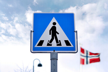 Pedestrian, blue road sign in Norway