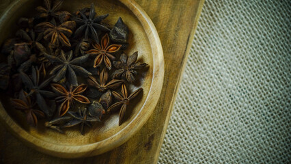 condiments and spices hot peppers saffron cloves and nuts. rustic farmhouse style mortar. ingredients for cooking.