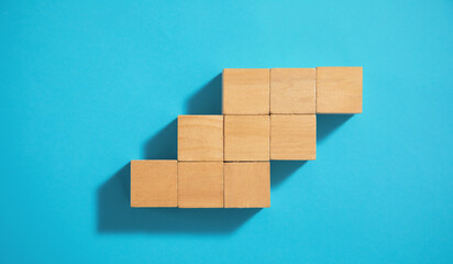 Wooden cubes on the blue background.