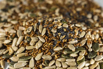 Fotobehang seed mix with sesame seeds, poppy seeds, pumpkin seeds and sunflower seeds © Mariana