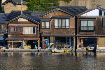 Fototapeta na wymiar Lined up boathouses at Ine Town in Kyoto, Japan 