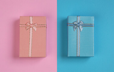 
A blue and pink gift box placed against a backdrop of opposite colors.