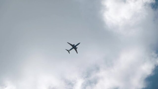 Passenger plane flying in the clouds