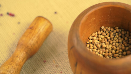 condiments and spices hot peppers saffron cloves and nuts. rustic farmhouse style mortar. ingredients for cooking.