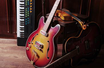 Three electric guitars and a synthesizer in the interior.