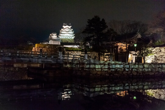Himeji, Japan - January 7, 2020. Exterior night shot of Himeji castle in Japan. Himeji is one of the few remaining traditionally constructed Japanese castle. It is a major tourist attraction.