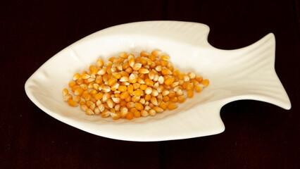 Popcorn kernels in fish shaped plate