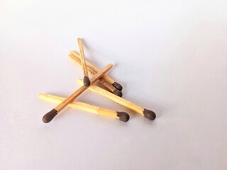 a bunch of wooden matches isolated on a white background or on white paper