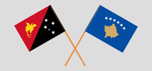 Crossed flags of Papua New Guinea and Kosovo. Official colors. Correct proportion