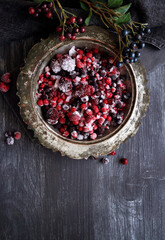 Frozen berry mix on a black background