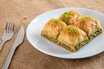 Pistachio baklava on a white plate