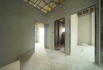 Fototapeta premium Empty under construction room in home or house with space on site. Interior. Old unfurnished room rental property, living space units. lifestyle. Renovation.