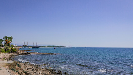Small shallow sea creek with stones under the sun