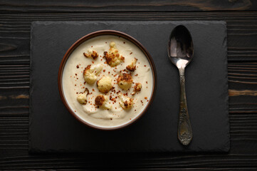 Creamy cauliflower soup with fried cauliflower and croutons.