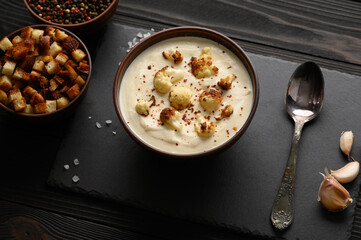 Creamy cauliflower soup with fried cauliflower and croutons.