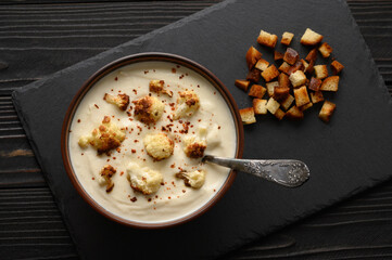 Creamy cauliflower soup with fried cauliflower and croutons.