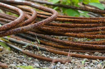 Cast iron with some rust due to corrosion. Picture taken with a blur background