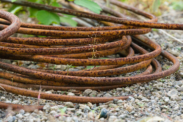Cast iron with some rust due to corrosion. Picture taken with a blur background