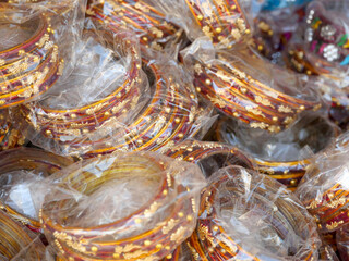 Display of Colorful Bangles for wearing in hand by women, female, girls in India.