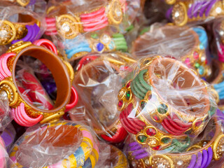 Display of Colorful Bangles for wearing in hand by women, female, girls in India.