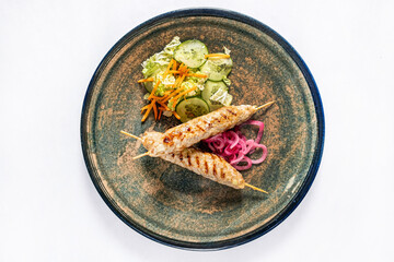 chicken kebab with fresh salad