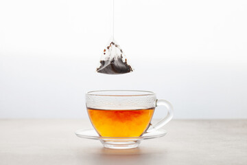 Cup of tea with a bag. Tea drink gradient