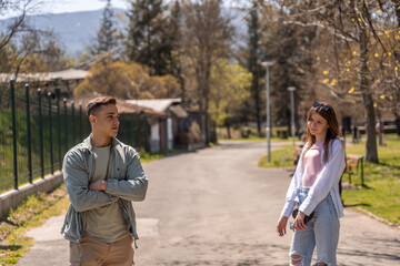 Beautiful happy young couple backside outdoors in spring park