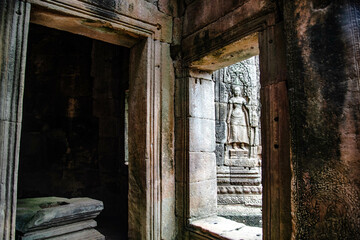 The doors and windows in Bayon Temple overlook the Na Apsara sandstone carvings outside in Angkor Thom, Siem Reap, Cambodia.