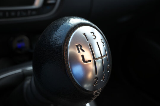 Six-speed manual transmission car. Close-up of shifting gear lever.