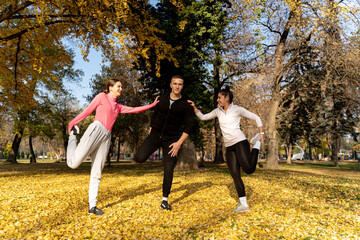 Fototapeta premium Stretching together and smiling in the park