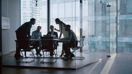 Group of business partners discussing company development strategy in modern office - Powered by Adobe