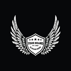 Premium white wings badge shield emblem logo design vector isolated on black background
