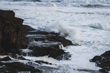 Natural view of big waves hitting the rock in the seashore