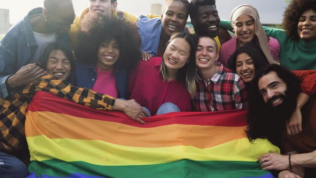 Happy diverse young friends celebrating gay pride festival - LGBTQ community concept