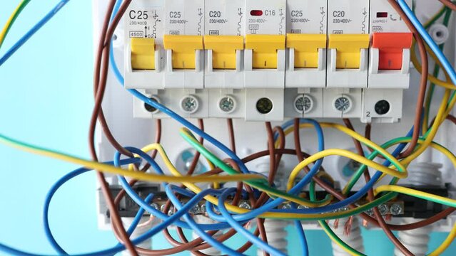 Fuse box panel installation at home, electrical work with household electricity.