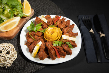 Traditional Turkish appetizer Cigkofte with lavash, ingredients are raw, meat bulgur ,onion, tomato paste, chili pepper and salt. Turkish local raw food concept