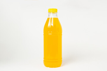 Bottle of juice on a white background. Plastic bottle with orange juice. Delicious and refreshing drink