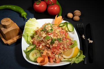 Delicious salad with tomatoes and walnuts.