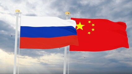 Russian and China Flags are waving in the spring of the blue sky. 3d rendering.