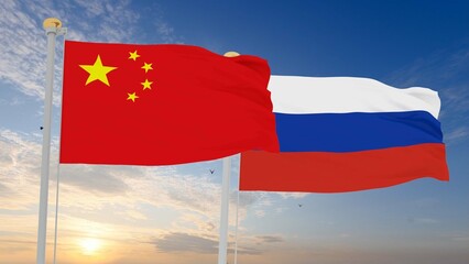 Russian and China Flags are waving in the spring of the blue sky. 3d rendering.