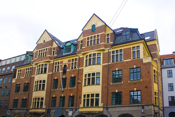Fototapeta na wymiar Beautiful red brick building at Stroget street in Copenhagen, Denmark
