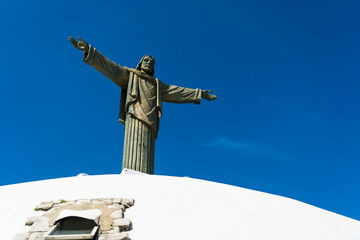 Closeup of Jesus statue at the top of Mount Isabel de Torres in Puerto Plata, Dominican Republic - obrazy, fototapety, plakaty