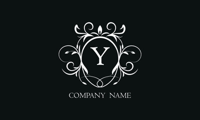 Elegant floral monogram with decorative elements and the letter Y. Template for invitations, labels, business. Wedding monograms. Exquisite calligraphic ornament.